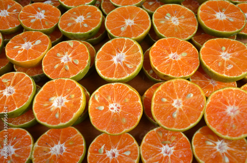 Orange cut into pieces corner on healthy food concept top view image