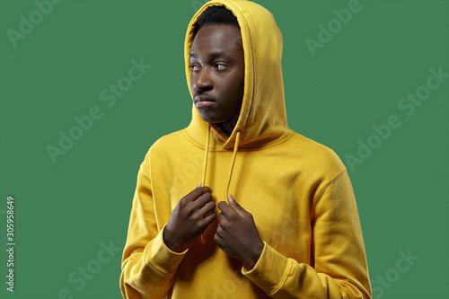 young black man in yellow hoodie