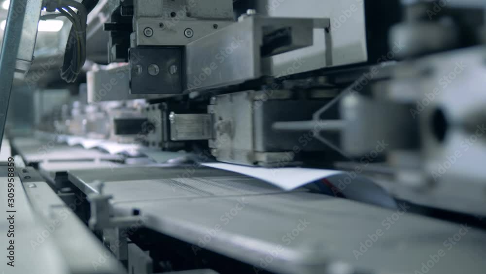 Typography machine moves books on a conveyor, automated production. Typography machine moves books on a conveyor, automated production.
