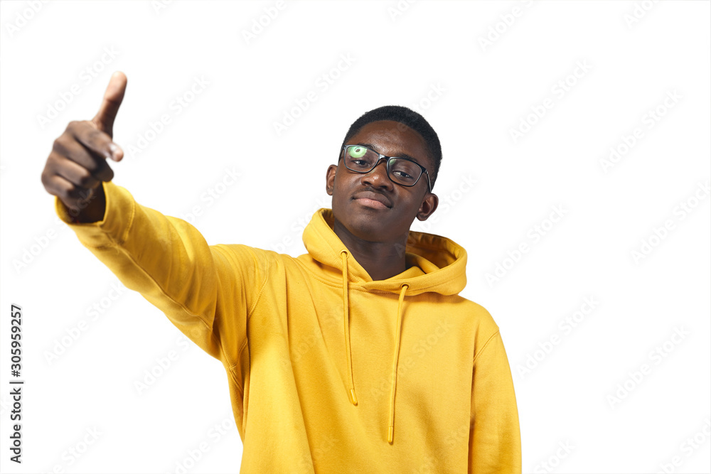 young black man in yellow hoodie in glasses young black man in yellow hoodie in glasses