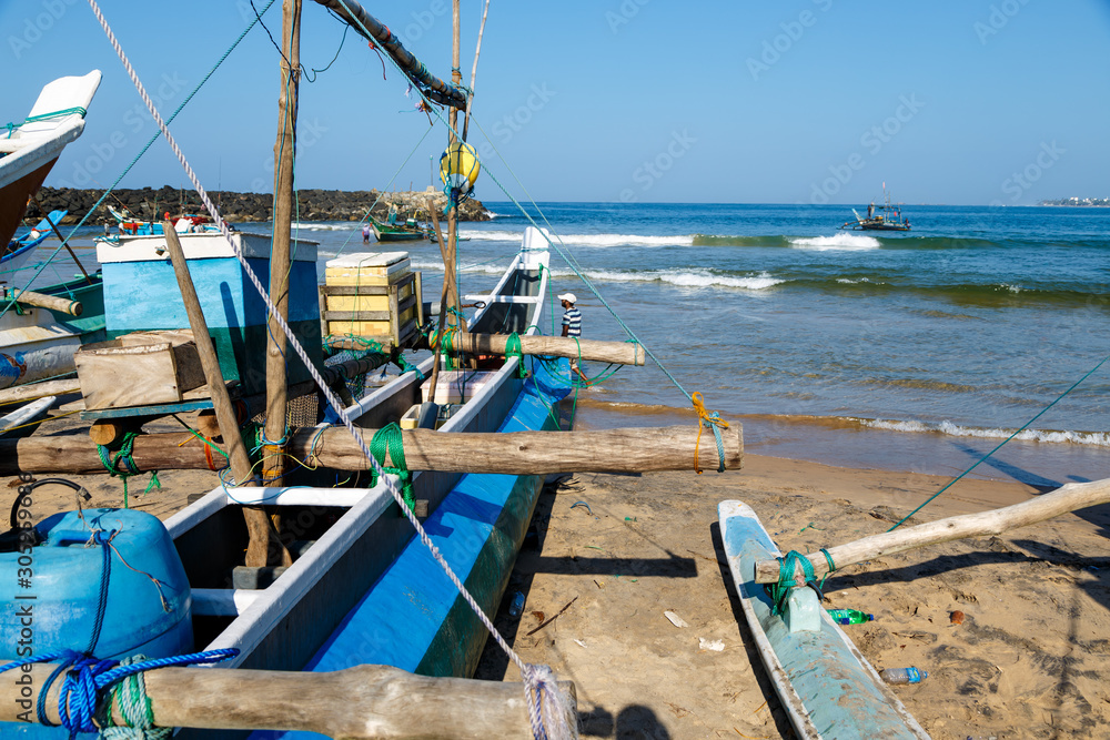 fishing boat Galle Sri Lanka close up on ocean shore