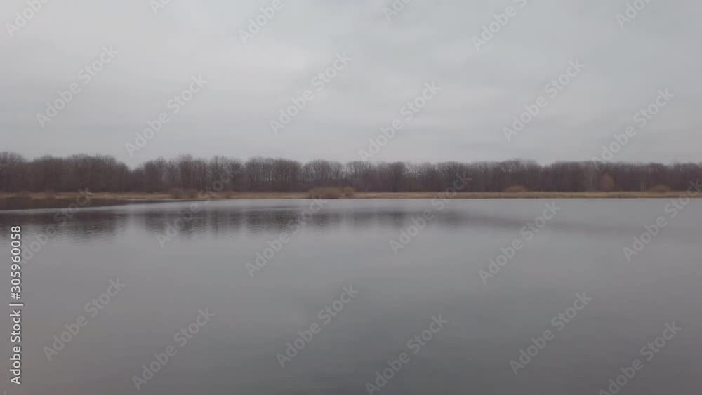 Panorama of a large lake or river on a cloudy dark autumn day Panorama of a large lake or river on a cloudy dark autumn day