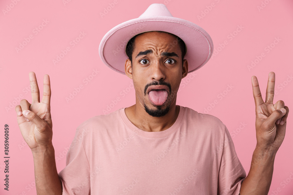 Photo of scared african american man gesturing peace sign Photo of scared african american man gesturing peace sign