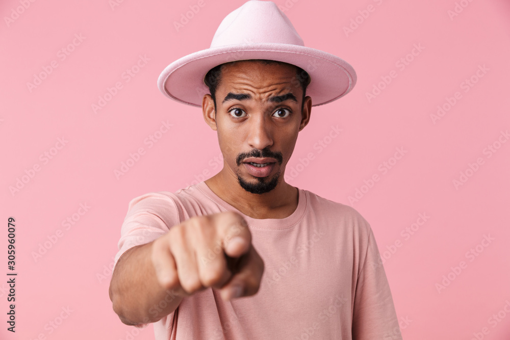 Photo of perplexed african american man pointing finger at camera Photo of perplexed african american man pointing finger at camera