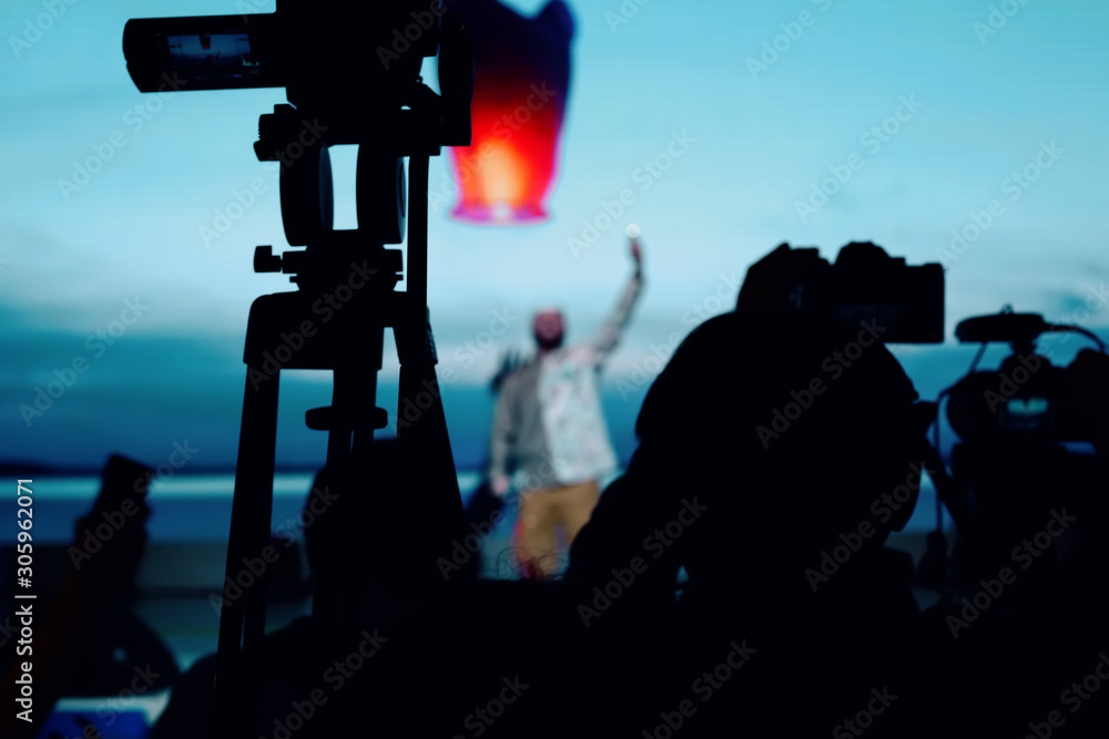 Fototapeta premium silhouette group of cameramen at an event
