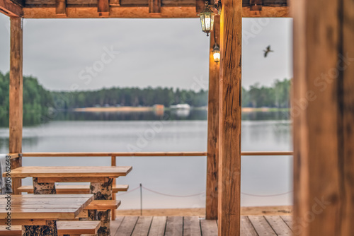 View from an outdoor cafe on the background of a forest lake