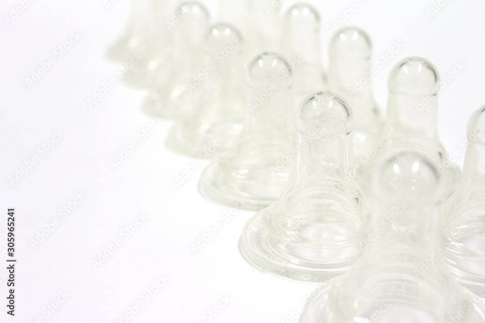 Babies silicone teats on white background, feed concept, isolated. Babies silicone teats on white background, feed concept, isolated.