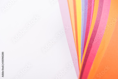 top view of colorful and bright papers isolated on white