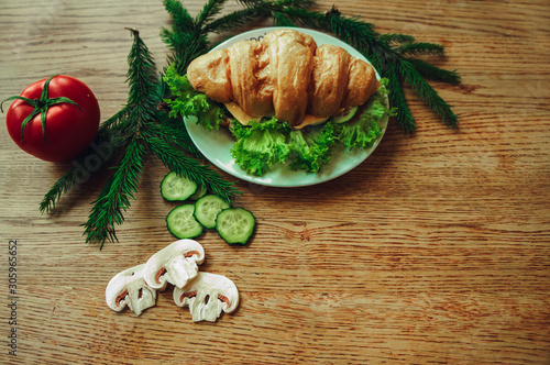 croissant with tomato cheese and mushrooms