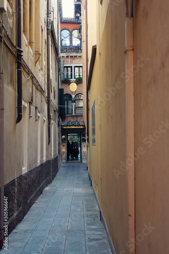 A narrow street through the Venetian houses