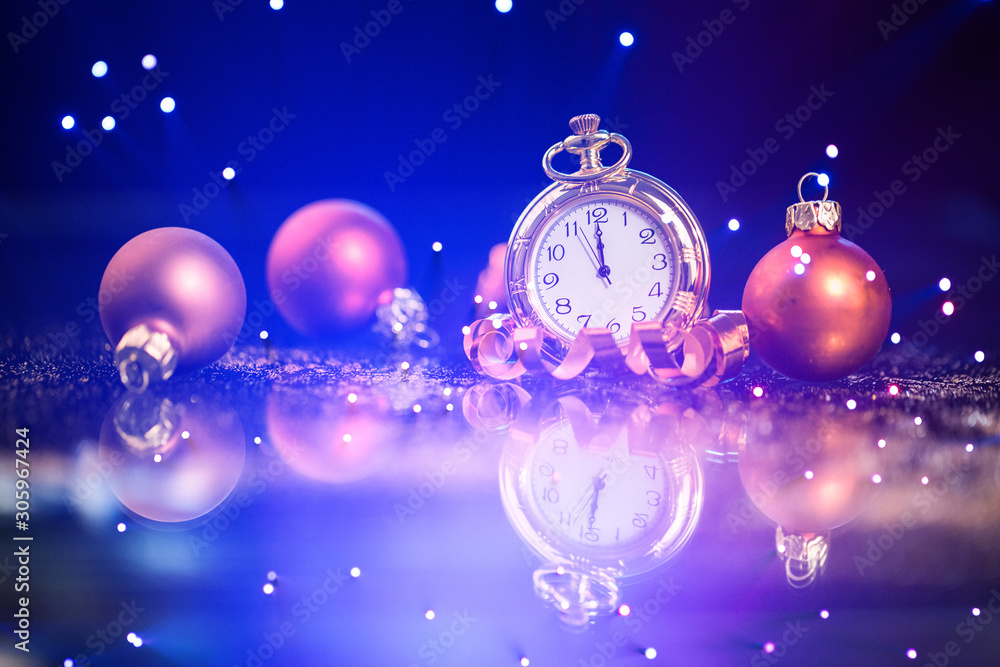 Festive holiday background with clock showing Midnight at New Years Eve.