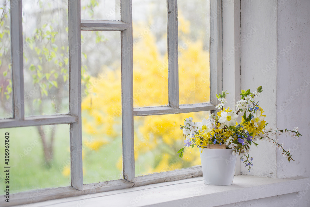 yellow spring flowers on windowsill yellow spring flowers on windowsill