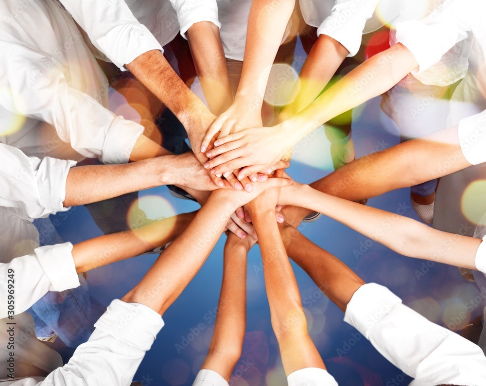 Handshake of many young business people, teamwork concept Handshake of many young business people, teamwork concept