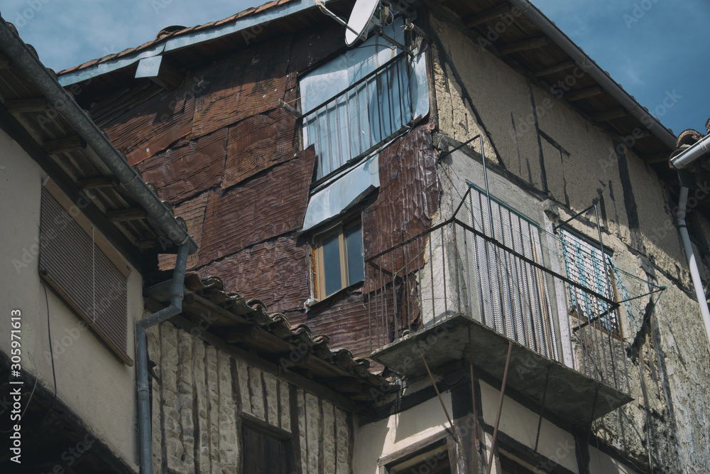 Deteriorated old house lined with rusty metal in Spain. Deteriorated old house lined with rusty metal in Spain.