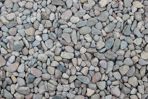 Pebbles of different shape, size, color and origin as a background