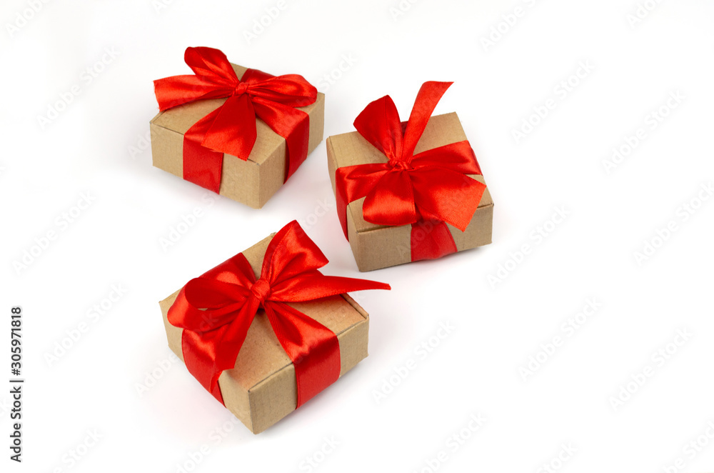 Merry Christmas gift boxes with red bow on a white background isolated minimalism. There is room for text or other design. Merry Christmas gift boxes with red bow on a white background isolated minimalism. There is room for text or other design.