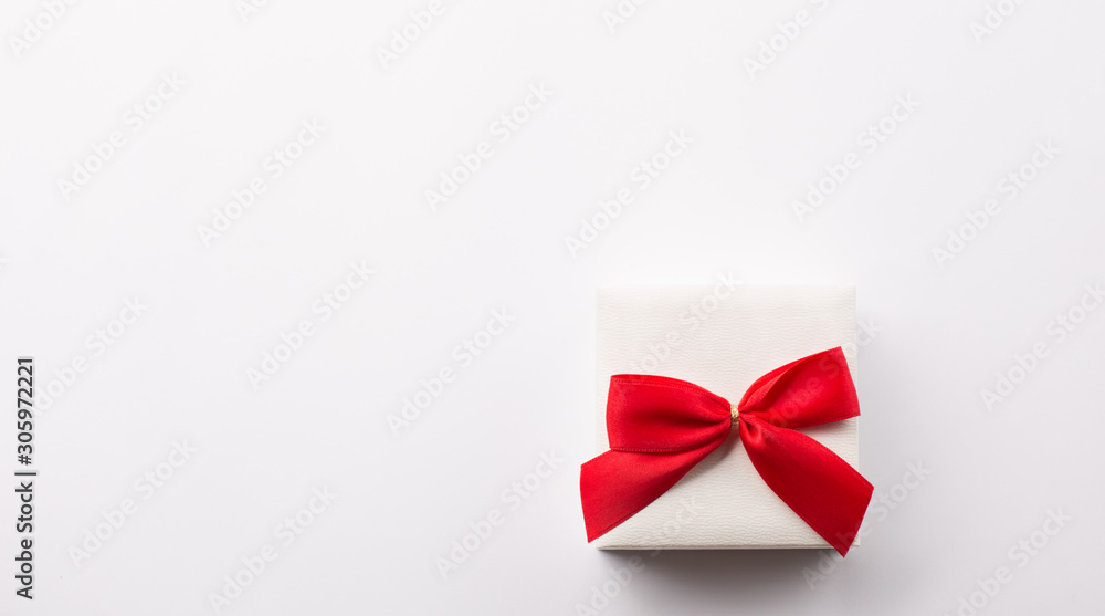 Present white gift box with red bow Present white gift box with red bow