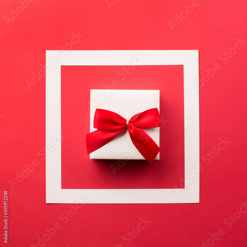 Present white gift box with red bow