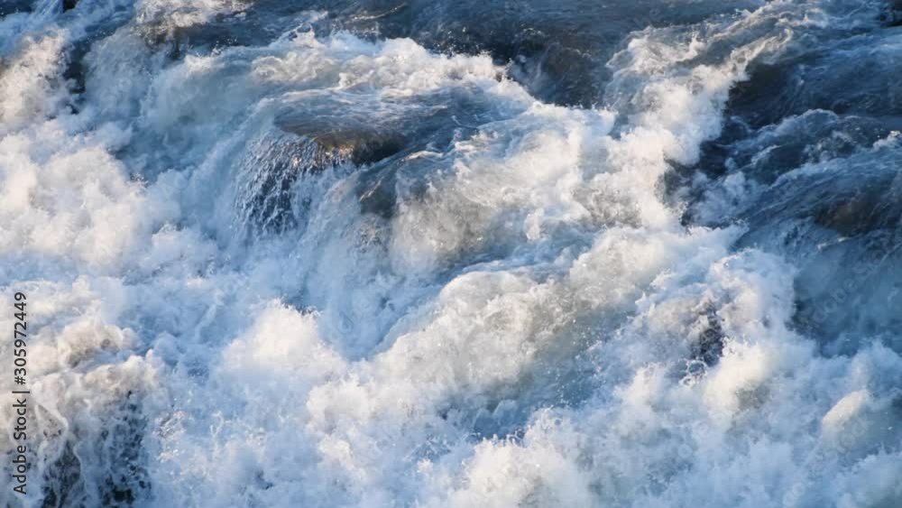 Water texture. Pure blue water with light reflections. Slow motion. Water texture. Pure blue water with light reflections. Slow motion.