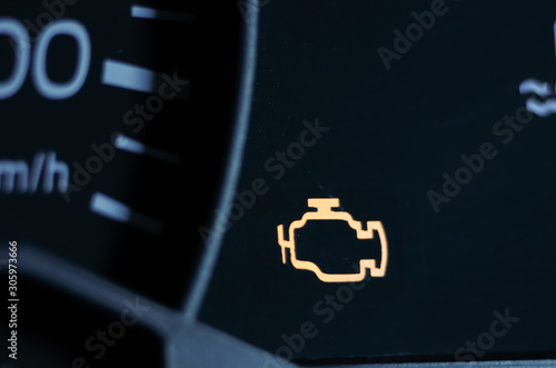 Obraz na plátně Yellow lit engine error sign on car dashboard close up