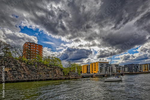 Photography Old and new waterfront apartment buildings on shore of Hammarby canal