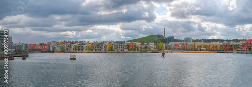 Modern multistorey apartment buildings on canal shore in Stockholm, Sweden. photo