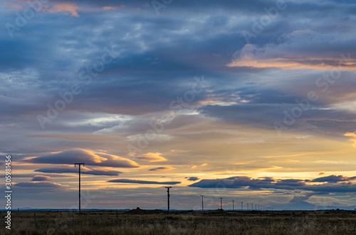 Iceland, autumn, sunrise, Typical icelandic landscape. Electric poles extending into the distance