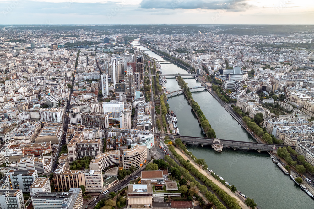Aerial panoramic view of Paris roofs and Seine river from Eiffel Tower. Paris, France.