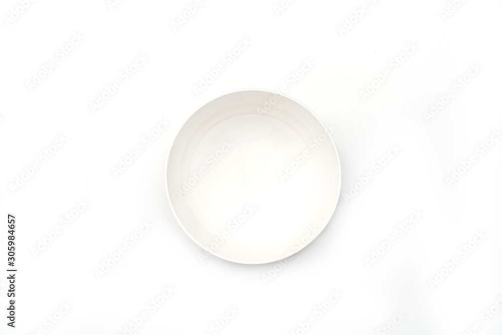 Fototapeta premium Empty white ceramic round plate isolated on white background..