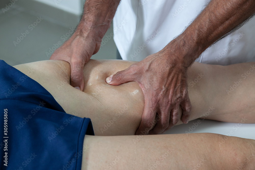 hand physiotherapist doing sports massage hand physiotherapist doing sports massage