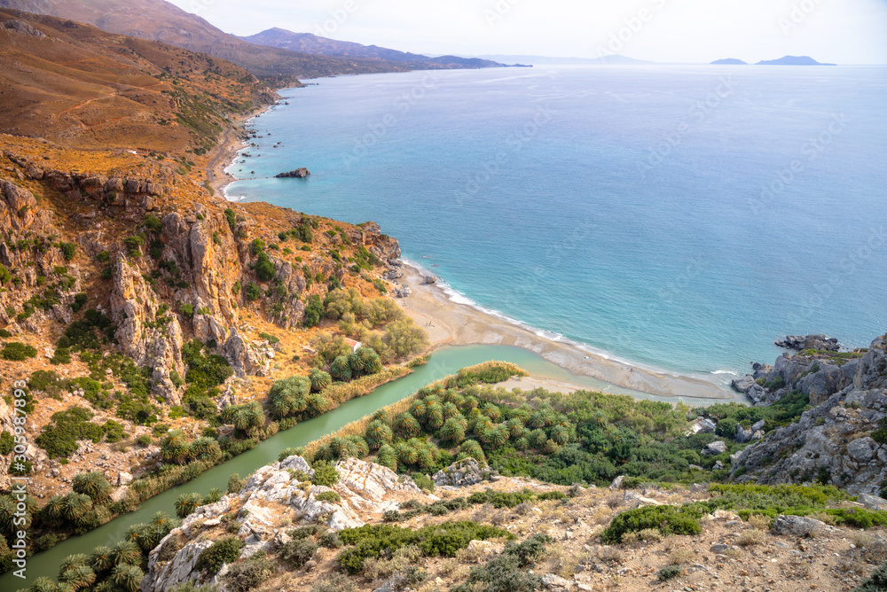 Panorama of Preveli beach at Libyan sea, river and palm forest, southern Crete , Greece