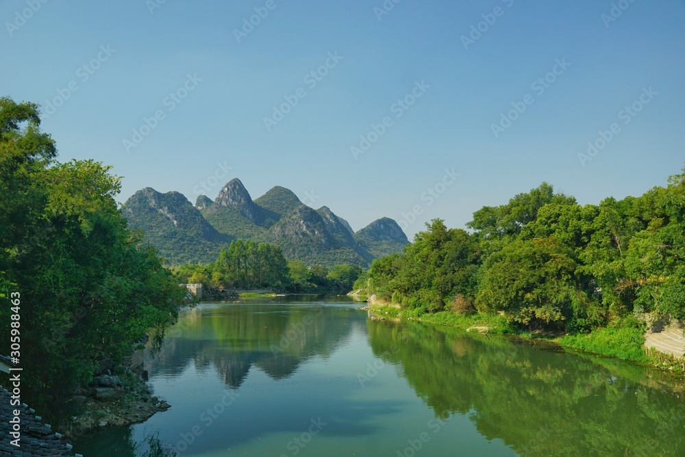 The view of karst landscape in the village of Lijiang in Guilin, China. The view of karst landscape in the village of Lijiang in Guilin, China.
