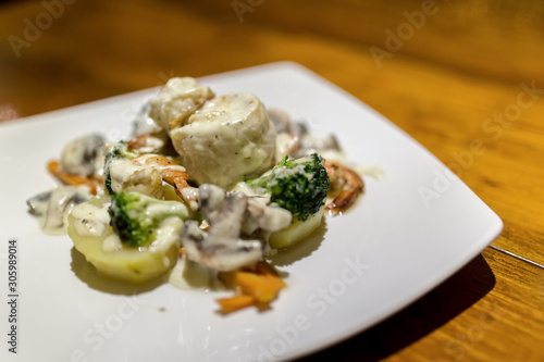 Ravioli with prawn shrimp Seafood, Spinach & Mushrooms in Garlic Cream Sauce photo