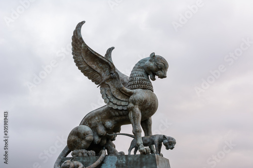 The sculpture female of winged snow leopard (Ak Bars, Aq Bars) with cubs, the symbol of Tatarstan near the Kazan wedding palace in the morning.