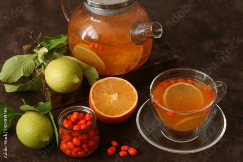 Tea of sea-buckthorn berries with lemon and orange