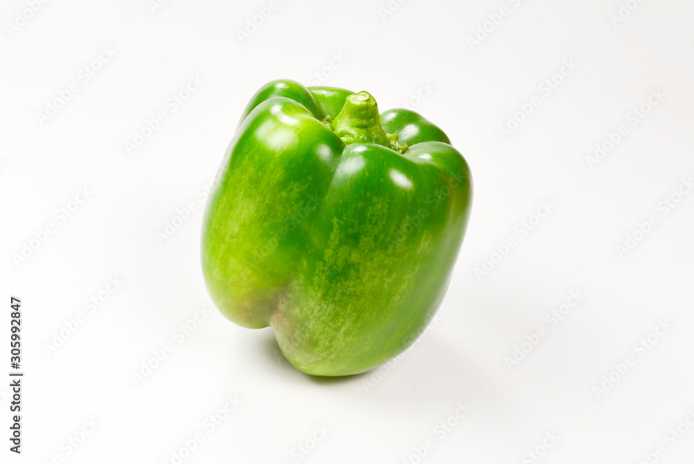 Group of green bell peppers isolated on white background. Group of green bell peppers isolated on white background.
