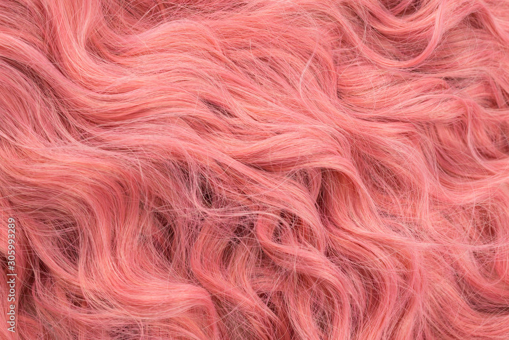 Fototapeta premium Pink wavy hair pattern. Top view.