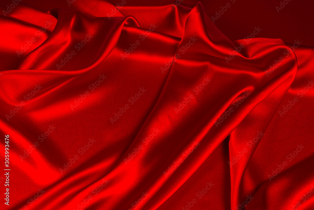 Red silk or satin luxury fabric texture can use as abstract background. Top view. Red silk or satin luxury fabric texture can use as abstract background. Top view.