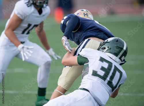 Action photos of high school football players making amazing plays during a football game