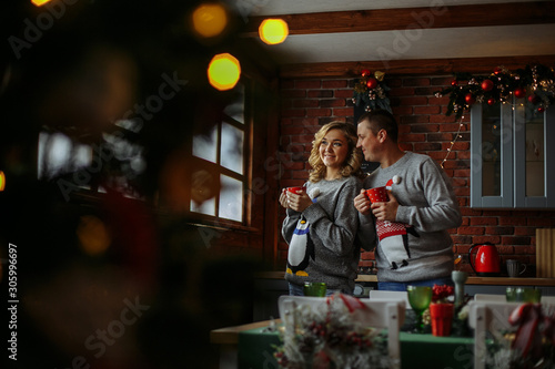 husband and wife drink tea in the kitchen © Andrii