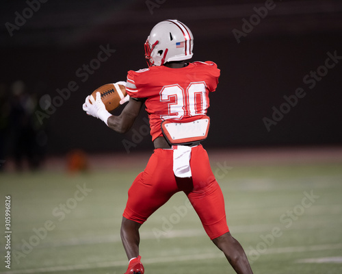 Action photos of high school football players making amazing plays during a football game