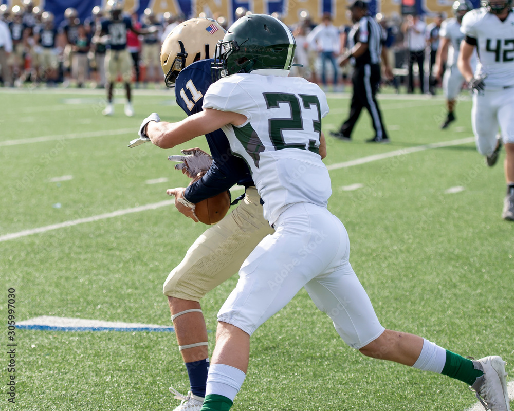 Action photos of high school football players making amazing plays during a football game Action photos of high school football players making amazing plays during a football game