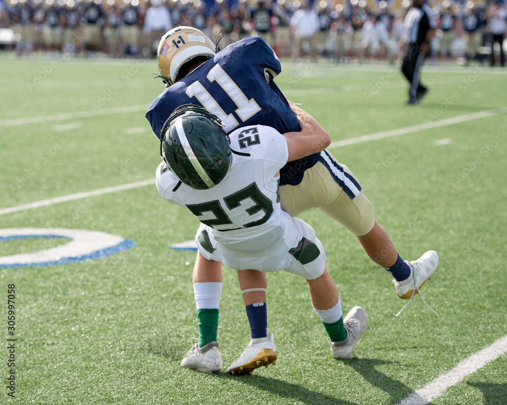 Action photos of high school football players making amazing plays during a football game Action photos of high school football players making amazing plays during a football game