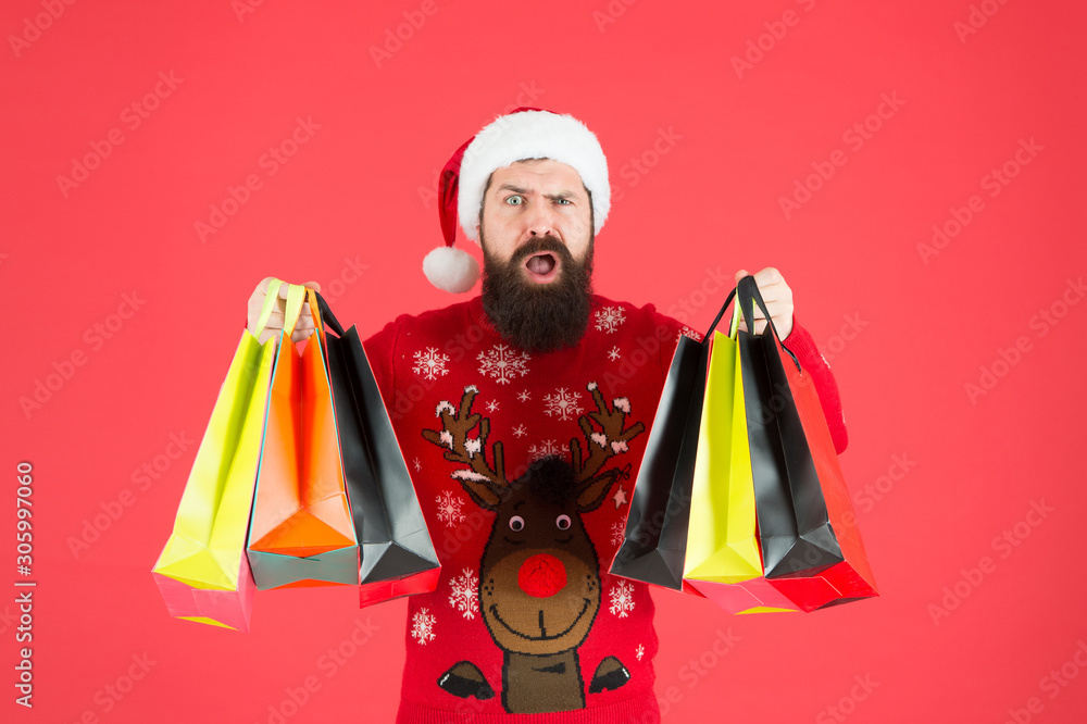 Discount. Winter shopping on budget. Upgrade your wardrobe. Man bearded hipster wear christmas sweater hold shopping bags. Sale of season. Buy new year gifts. Shopping for presents. Nice purchase Discount. Winter shopping on budget. Upgrade your wardrobe. Man bearded hipster wear christmas sweater hold shopping bags. Sale of season. Buy new year gifts. Shopping for presents. Nice purchase