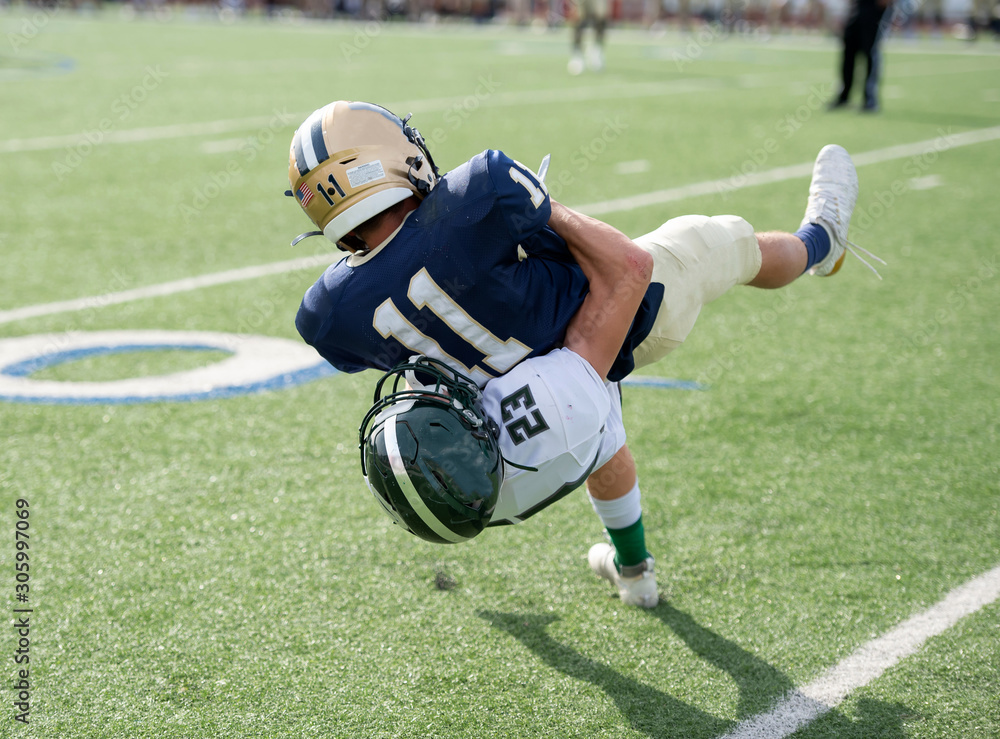 Action photos of high school football players making amazing plays during a football game Action photos of high school football players making amazing plays during a football game
