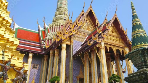 BANGKOK, THAILAND - MAY 12, 2019: The outstanding architecture of Grand Palace - Royal Pantheon with prang tower, gilt, carvings, mirror pattern, pyathat roof and colorful tile, on May 12 in Bangkok photo