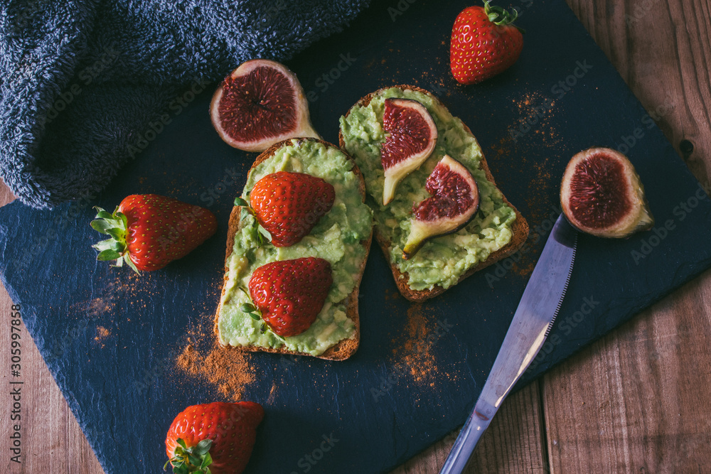 avocado or guacamole toast with berries