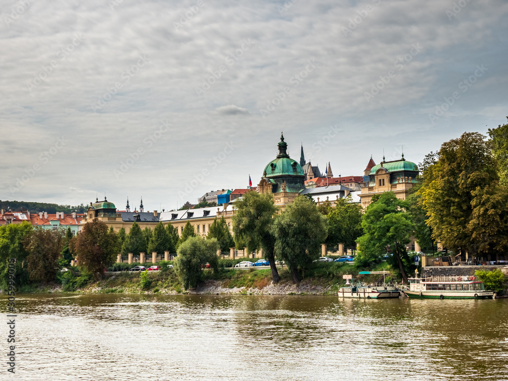 Obraz premium View from Boat to Old Town of East Europe Prague City with stunning sky sunset