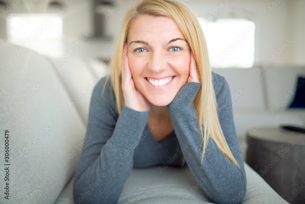 Relaxed woman enjoying rest on comfortable sofa, calm attractive girl relaxing on couch Relaxed woman enjoying rest on comfortable sofa, calm attractive girl relaxing on couch
