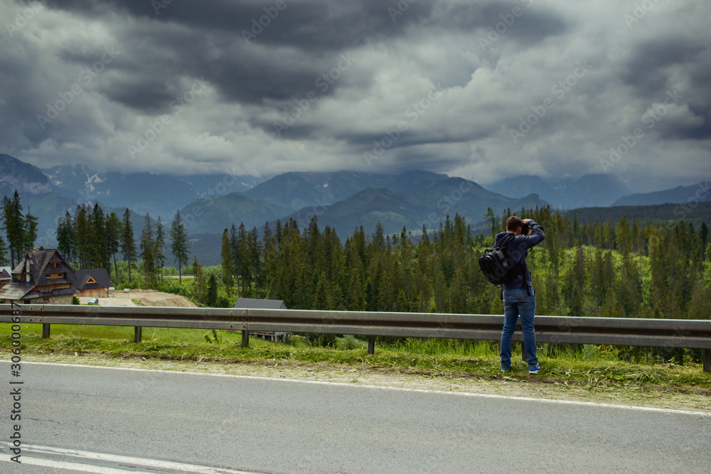 Nature photographer taking photos in the mountains Nature photographer taking photos in the mountains